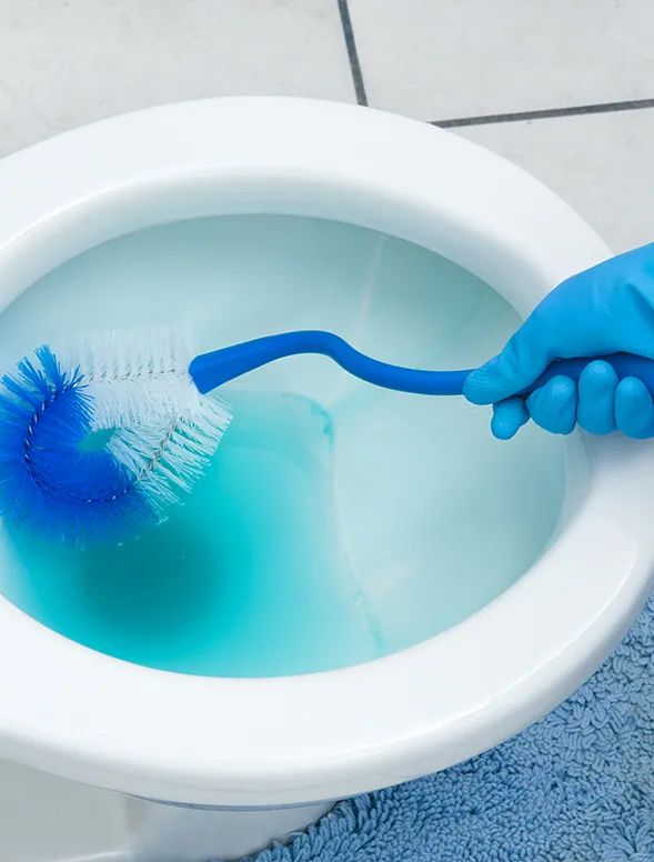 Cleaning technician wiping down an office